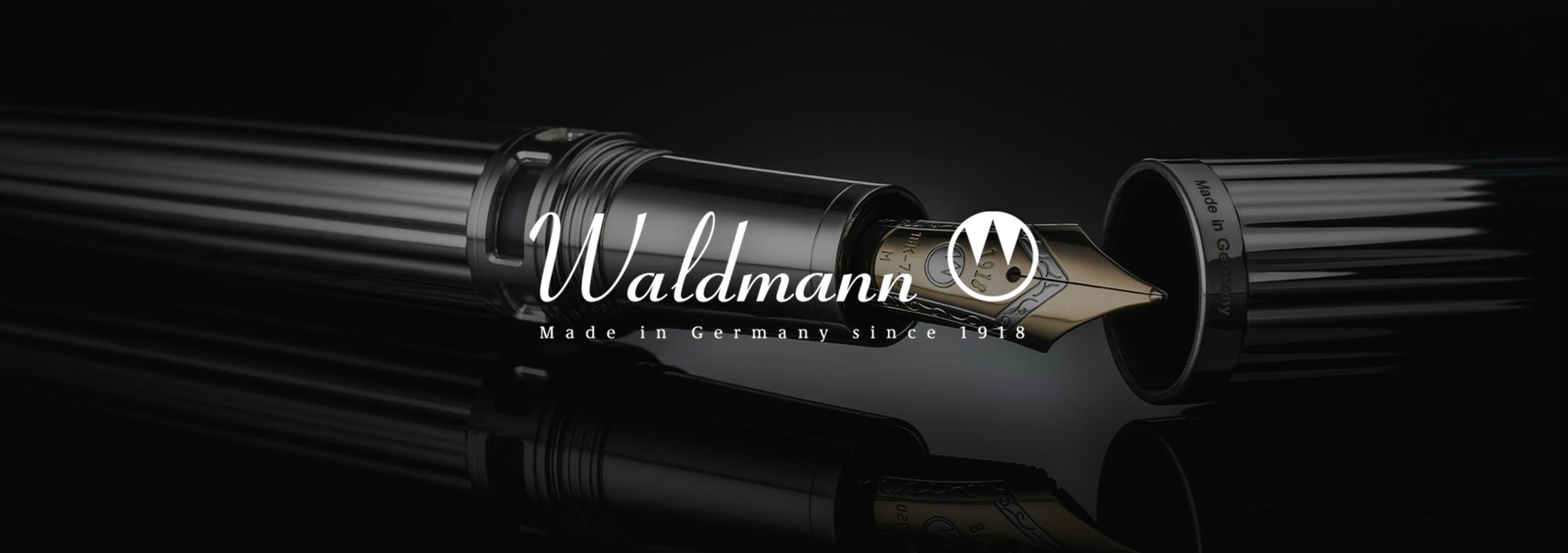 Black pen with 'Waldmann' branding on a dark background